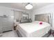 Main bedroom with a plush bed and ample dresser space at 4222 Trucious Pl # 4222, New Port Richey, FL 34652
