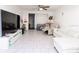 Spacious living room, featuring a large TV and sectional sofa at 4222 Trucious Pl # 4222, New Port Richey, FL 34652
