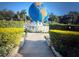 View of community landmark featuring an Earth statue surrounded by manicured hedges at 2070 World Parkway Blvd # 50, Clearwater, FL 33763