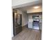 Kitchen featuring gray cabinets, modern appliances, and hardwood flooring at 2070 World Parkway Blvd # 50, Clearwater, FL 33763