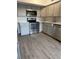 Updated kitchen features stainless steel appliances, ample cabinet space, and light wood flooring at 2070 World Parkway Blvd # 50, Clearwater, FL 33763