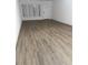 Bright, spacious living room featuring modern flooring and a window with natural light at 2070 World Parkway Blvd # 50, Clearwater, FL 33763