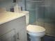 Bathroom with a toilet and shower stall at 2070 World Parkway Blvd # 50, Clearwater, FL 33763