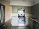 Modern kitchen with gray cabinets and stainless steel appliances at 2070 World Parkway Blvd # 50, Clearwater, FL 33763