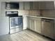 Modern kitchen featuring stainless steel appliances and light gray cabinets at 2070 World Parkway Blvd # 50, Clearwater, FL 33763