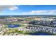 Aerial view of a suburban neighborhood with serene ponds and well-maintained landscaping at 17518 Canopy Pl, Bradenton, FL 34211
