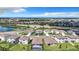 Wide aerial view showcasing a residential neighborhood, road network, and multiple ponds at 17518 Canopy Pl, Bradenton, FL 34211