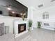Inviting living room with a modern fireplace, neutral tones, and ample natural light at 17518 Canopy Pl, Bradenton, FL 34211
