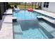 Sparkling pool with pristine blue water and a built-in spa is perfect for a refreshing dip at 17518 Canopy Pl, Bradenton, FL 34211