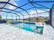 Large screened pool and spa with waterfront views and ample seating offer the ideal outdoor retreat at 17518 Canopy Pl, Bradenton, FL 34211