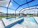 Beautiful pool and spa with a screened enclosure, inflatable swan, and views of the surrounding area at 17518 Canopy Pl, Bradenton, FL 34211