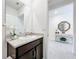 Single vanity bathroom with a granite countertop and a view of the hallway at 17518 Canopy Pl, Bradenton, FL 34211