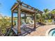 Relaxing pergola with lounge chairs near pool at 17518 Canopy Pl, Bradenton, FL 34211
