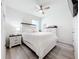Cozy bedroom with a queen-size bed, nightstand, and ample floor space at 17518 Canopy Pl, Bradenton, FL 34211