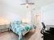 Charming bedroom with a full-size bed, built-in desk, and plenty of storage at 17518 Canopy Pl, Bradenton, FL 34211