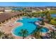 Community pool with expansive deck and lounge chairs at 17518 Canopy Pl, Bradenton, FL 34211