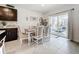 Charming dining area with a table and chairs near sliding doors leading to the outdoors at 17518 Canopy Pl, Bradenton, FL 34211