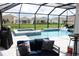 Screened pool and spa with comfortable seating area at 17518 Canopy Pl, Bradenton, FL 34211