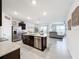 Spacious kitchen with island, stainless steel appliances, and granite countertops at 17518 Canopy Pl, Bradenton, FL 34211
