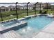 Resort-style pool and spa with water features at 17518 Canopy Pl, Bradenton, FL 34211