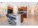 Modern kitchen with island, stainless steel appliances, and breakfast bar at 7104 Wiseman Run Dr, Ruskin, FL 33573