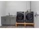 Functional laundry room with LG washer and dryer and a utility sink at 2228 Valrico Forest Dr, Valrico, FL 33594