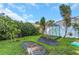 Landscaped garden with raised garden beds and lush greenery at 2228 Valrico Forest Dr, Valrico, FL 33594