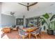 Inviting patio with outdoor seating, dining area, and lush greenery at 2228 Valrico Forest Dr, Valrico, FL 33594