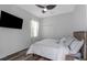 Cozy bedroom with a wood bed frame and large TV at 2228 Valrico Forest Dr, Valrico, FL 33594