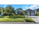 Stunning two-story home with a three-car garage and beautiful landscaping at 2228 Valrico Forest Dr, Valrico, FL 33594