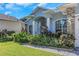 Two-story house with lush landscaping and a brick facade at 2228 Valrico Forest Dr, Valrico, FL 33594