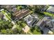 Aerial view of houses in a residential neighborhood with pools at 2228 Valrico Forest Dr, Valrico, FL 33594