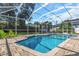 Inviting swimming pool with screened enclosure and patio area at 2228 Valrico Forest Dr, Valrico, FL 33594
