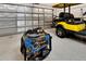 Garage with a golf cart and a generator, providing convenience and peace of mind at 19443 Sea Glass Cir, Land O Lakes, FL 34638