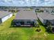 Aerial view of home with screened patio and backyard at 19443 Sea Glass Cir, Land O Lakes, FL 34638