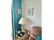Living room corner with a table lamp and coastal-themed decor at 6009 Sea Ranch Dr # 301, Hudson, FL 34667