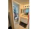 Bathroom with shower/tub combo, vanity, and coastal decor at 6009 Sea Ranch Dr # 301, Hudson, FL 34667