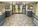 Building entrance with tiled floor and tropical decor at 6009 Sea Ranch Dr # 301, Hudson, FL 34667
