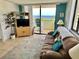Living room with comfortable seating and ocean view at 6009 Sea Ranch Dr # 301, Hudson, FL 34667