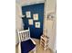 Bedroom corner with rocking chair and coastal decor at 6009 Sea Ranch Dr # 301, Hudson, FL 34667