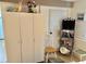 Bedroom with white wardrobe, wooden chair, and bookshelf at 6009 Sea Ranch Dr # 301, Hudson, FL 34667