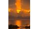 Intense orange sunset over calm water at 6009 Sea Ranch Dr # 301, Hudson, FL 34667
