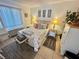Bedroom with coastal bedding, a white dresser, and two nightstands at 6009 Sea Ranch Dr # 301, Hudson, FL 34667