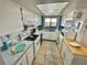 White kitchen with updated appliances and ocean view at 6009 Sea Ranch Dr # 301, Hudson, FL 34667