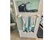 Clean bathroom with mosaic wave art and teal towels at 6009 Sea Ranch Dr # 301, Hudson, FL 34667