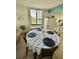 Dining area with table set for four and ocean view at 6009 Sea Ranch Dr # 301, Hudson, FL 34667