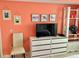 Additional living space with TV stand and seating at 6009 Sea Ranch Dr # 214, Hudson, FL 34667