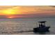 Boat on calm water during a sunset at 6009 Sea Ranch Dr # 214, Hudson, FL 34667