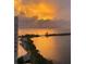 Sunrise over calm water with a view of shoreline at 6009 Sea Ranch Dr # 214, Hudson, FL 34667