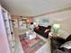 Open living room with leather seating and a view of the dining area at 6009 Sea Ranch Dr # 214, Hudson, FL 34667